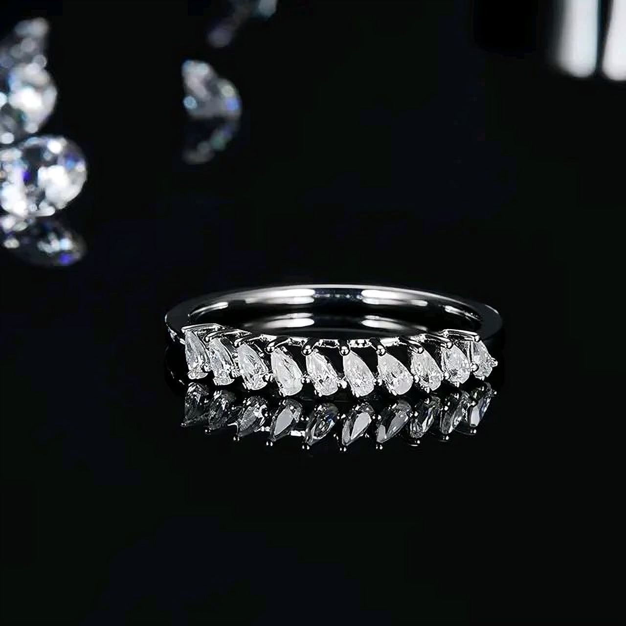 Pear cut multi Moissanite Ring