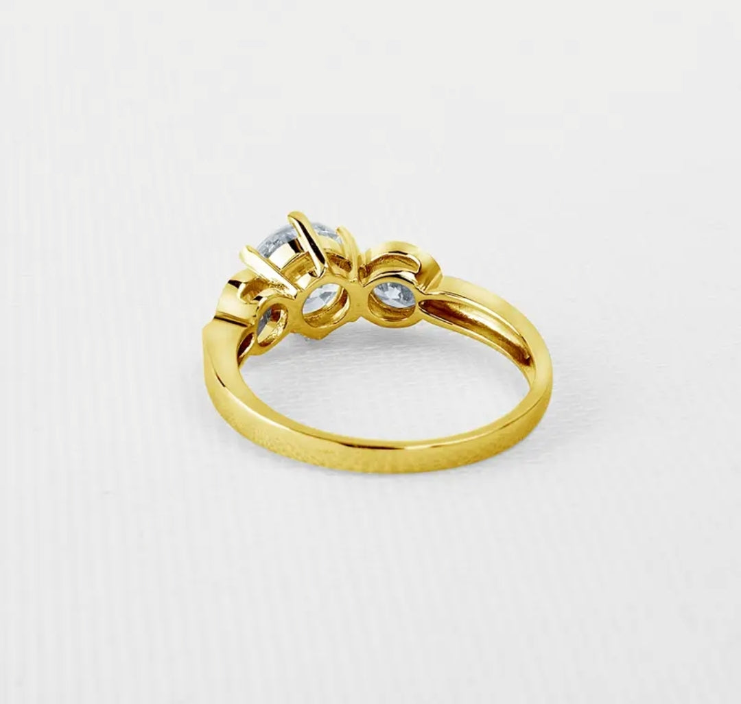 10k gold ring with 7mm 4mm 4mm brilliant moissanite