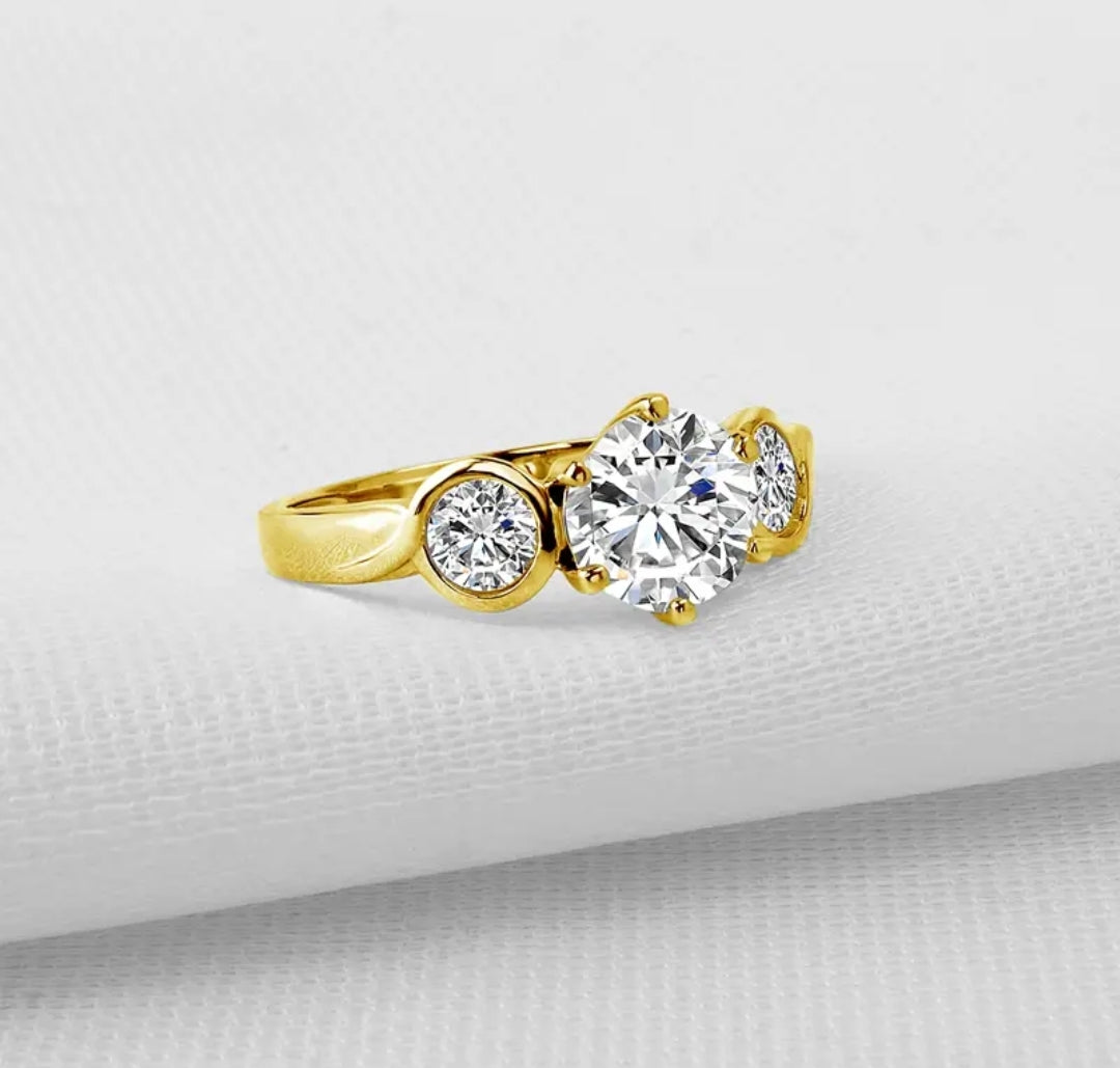 10k gold ring with 7mm 4mm 4mm brilliant moissanite